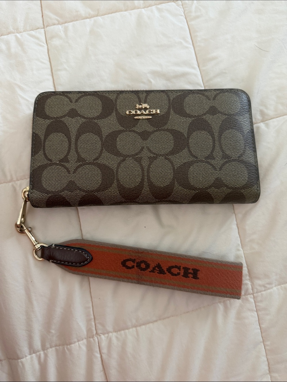 Coach Signature Zip Card Case in Dark Brown with Orange Strap
